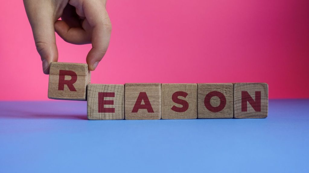 理由と英語で書かれたブロック