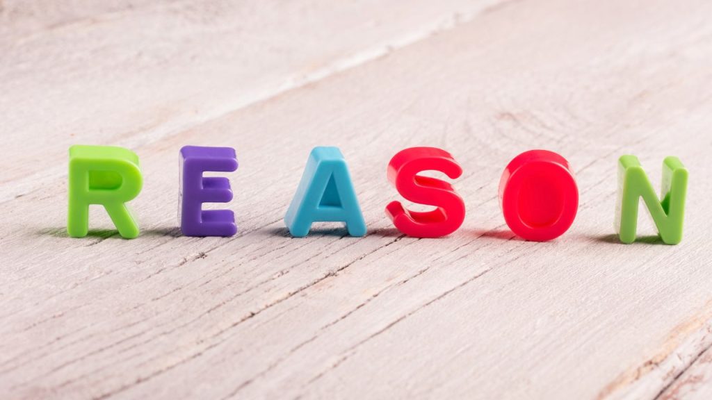 理由と英語で書かれたブロック